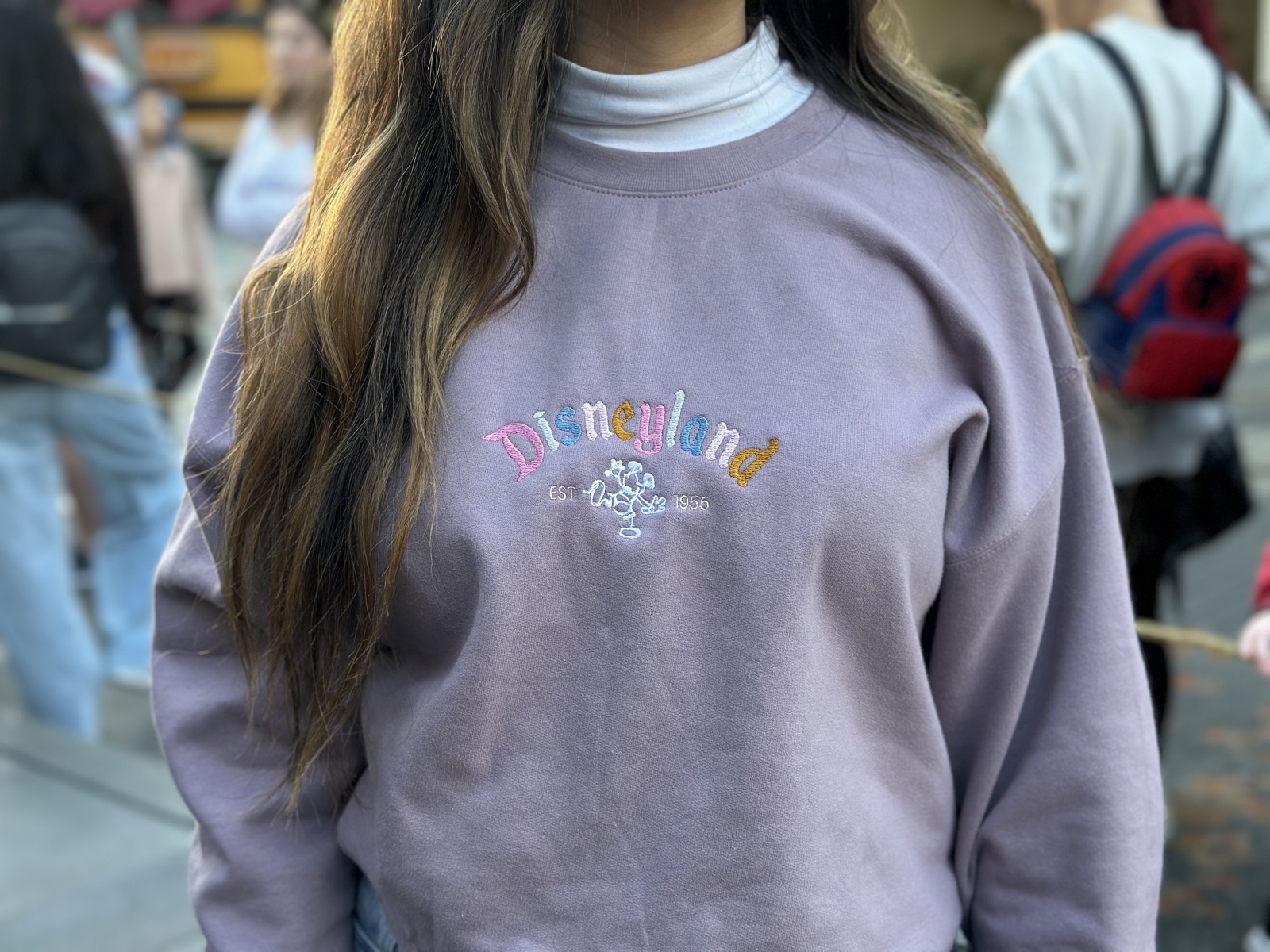Custom embroidered crewneck being worn